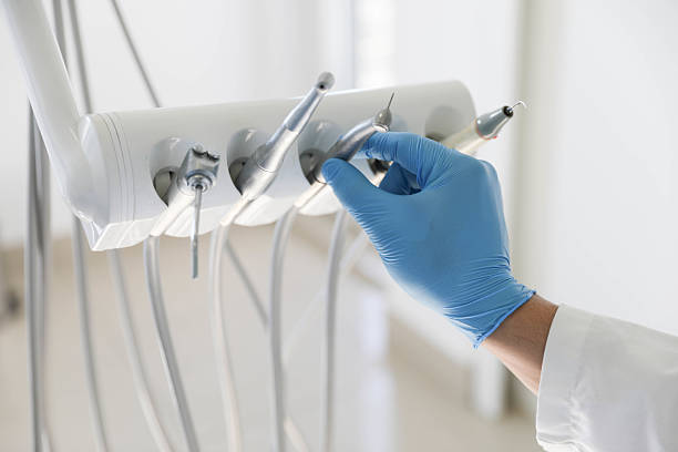 Professional Tooth Extraction technician working in Kent City, MI